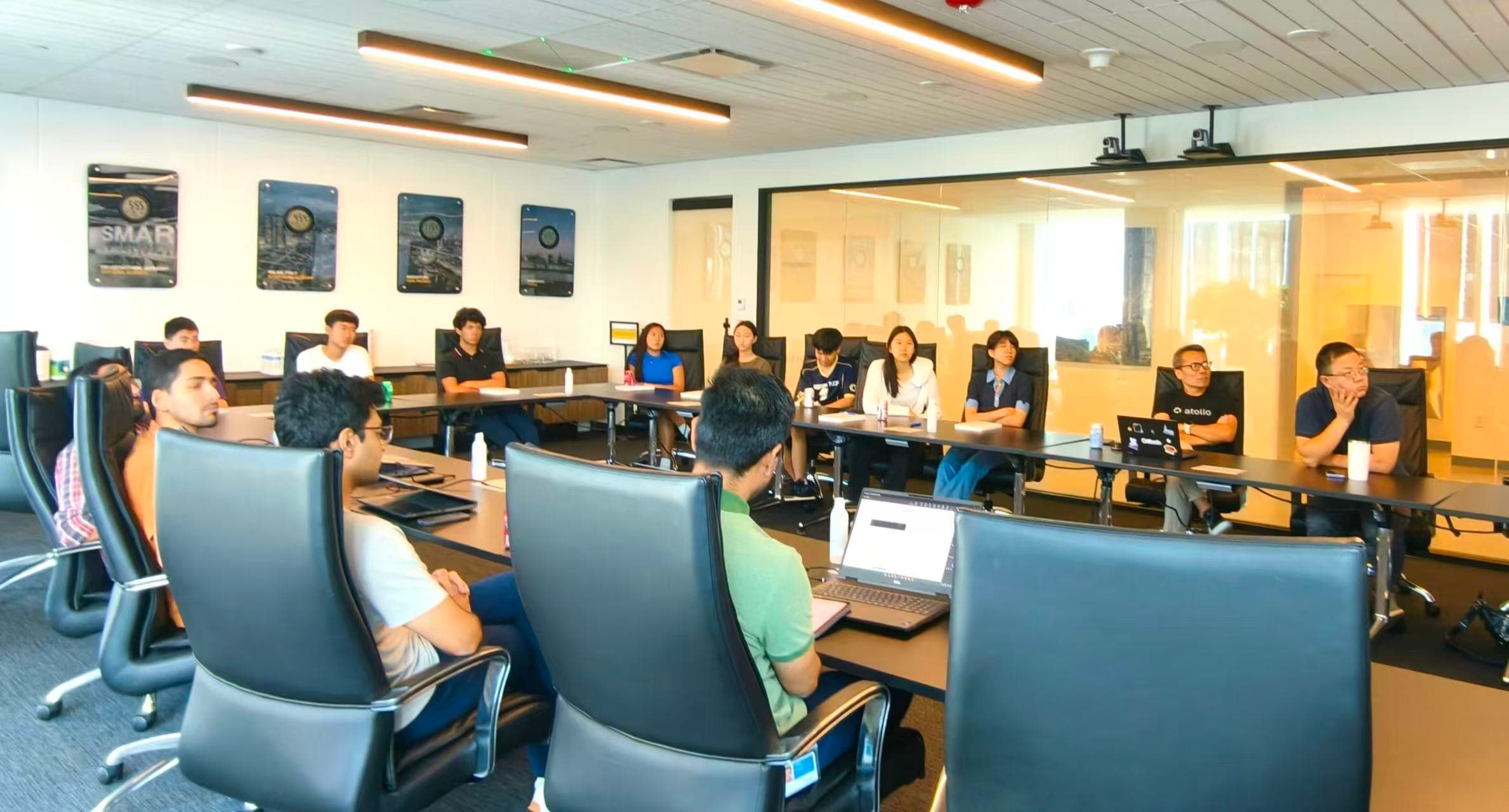 Students and professionals taking part in an in-person technology discussion