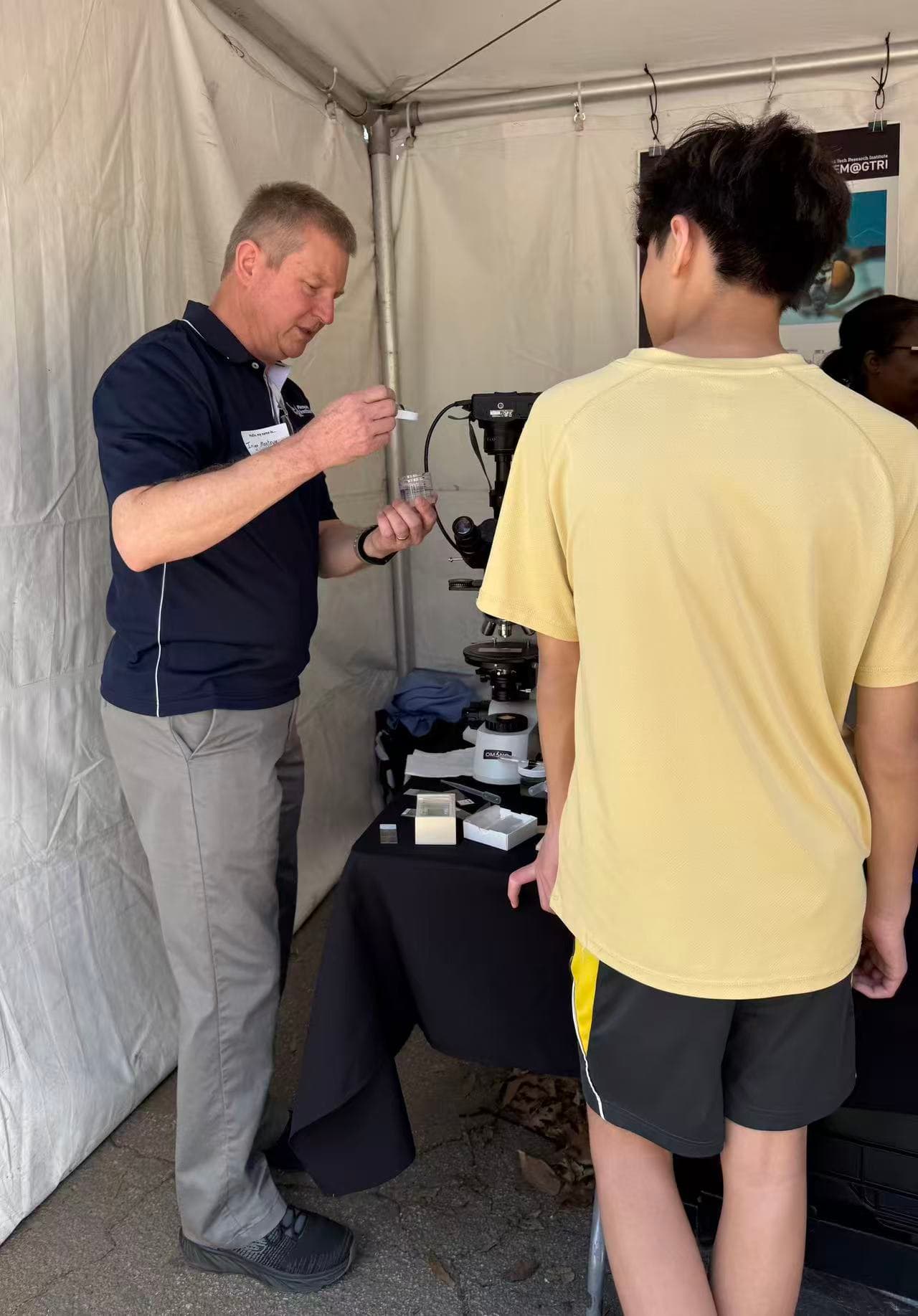 Students exploring health and environmental science exhibits from Emory University