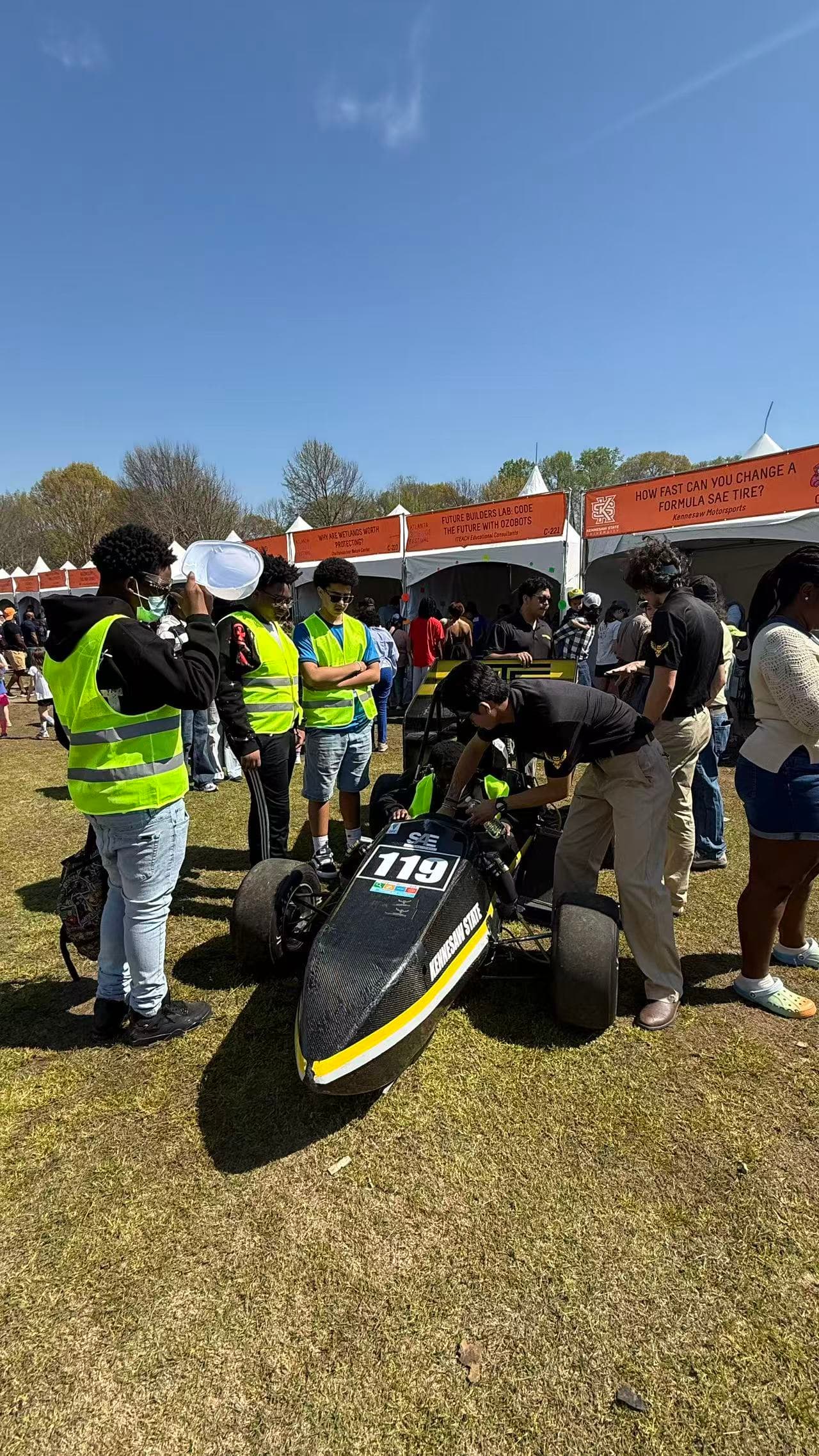 Students exploring engineering and motorsports at a public STEM festival